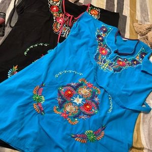 Two embroidered dresses